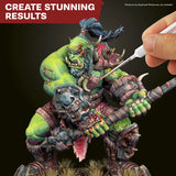 Hand painting a detailed fantasy figurine with text 'Create Stunning Results'.