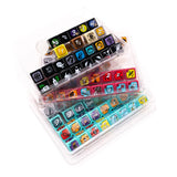 Set of colorful dice with various designs in a clear plastic case on a white background
