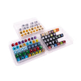 Set of colorful game pieces in clear plastic trays on a white background