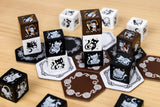 Hexagonal dice with cat illustrations on a wooden surface