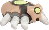 Plush toy resembling a turtle with green eyes on a white background