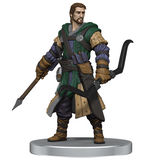 Figurine of a warrior character with armor and weapons on a white background