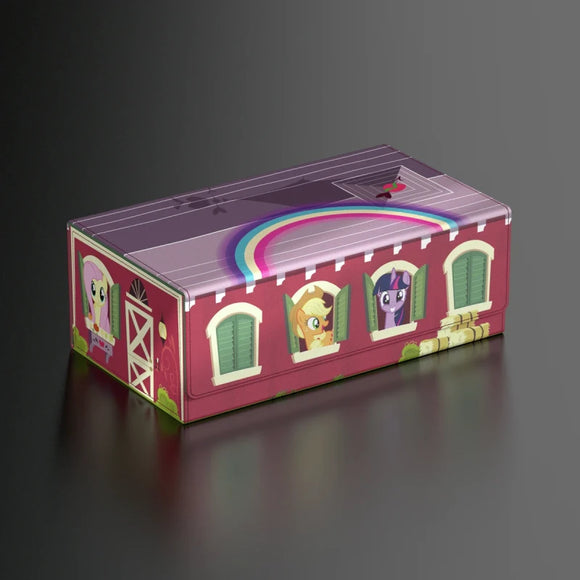 Toy box with cartoon designs of ponies and a rainbow on a dark background