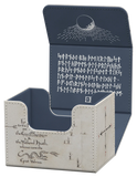 A square decorative storage box with a hinged lid, shown open against a plain white background. The exterior is a light warm gray/beige textured fabric with black script and line illustrations, while the interior and back of the lid are a dark navy blue with white rune-like symbols and a crescent moon graphic.
