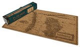 A fantasy-themed playmat featuring an engraved map design of the 'Wilderlands' from Lord of the Rings, shown alongside its dark green and gold Play-Mat box