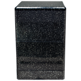 Black speckled side table with three drawers on a white background