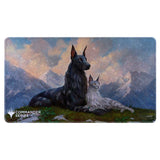 Game mat with two fantasy creatures and mountain landscape, featuring 'Commander Series' logo.