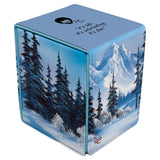 Card game box with mountain and forest design on a white background