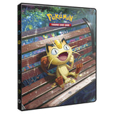 Pokémon trading card game binder with a character on a wooden platform