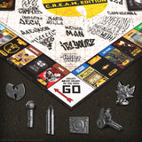 Board game components with graphics and text on a textured surface