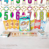 Flip 7 card game packaging with cards and game pieces on a light background