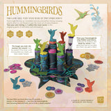 Hummingbirds game packaging with colorful hummingbird figures and sand timers on a light background.