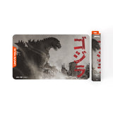 Godzilla-themed mouse pad with packaging on a white background