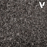 Close-up of dark gray gravel with a brand logo in the corner
