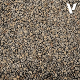 Close-up of small gravel stones with a brand logo in the corner.