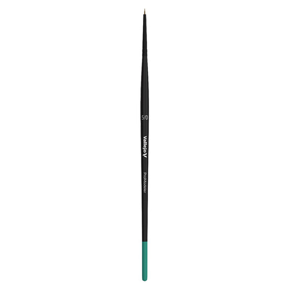 Black makeup brush with green tip on a white background