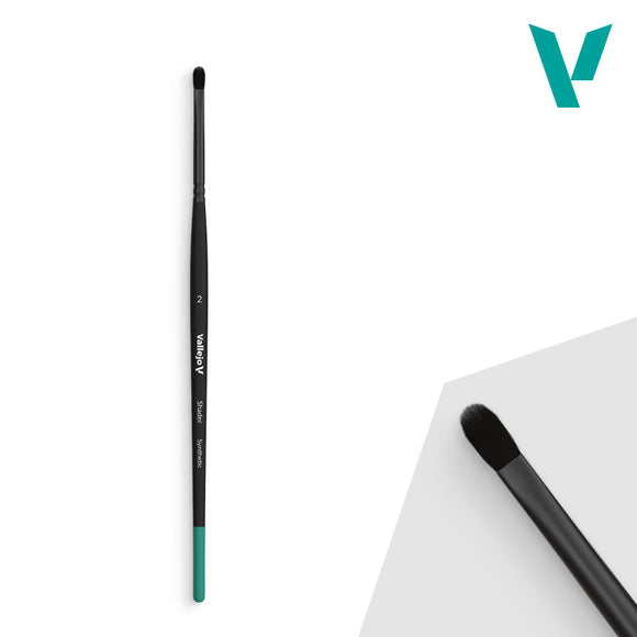 Two makeup brushes with black handles and green accents on a white background.