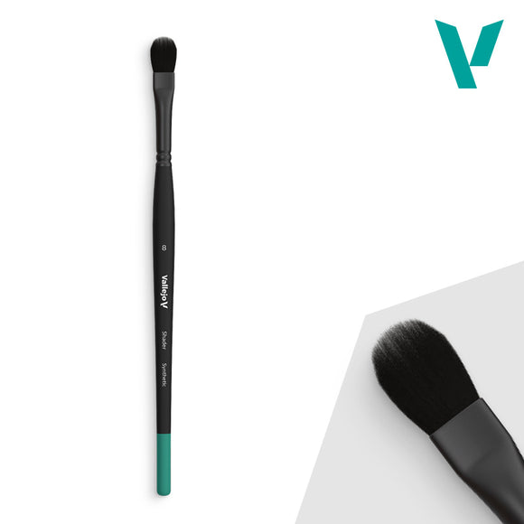 Makeup brush with black and green handle on a white background