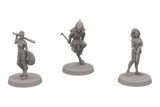 Three gray miniature figures on white background