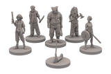 Set of six gray miniature figures on stands against a white background