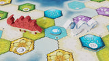 Board game with colorful hexagonal tiles and player pieces on a blue water-themed board