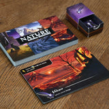 Card game with nature-themed cards on a wooden surface