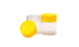 Two small glass jars with yellow lids on a white background