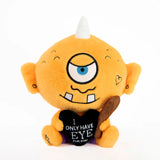 Orange plush toy with a single eye and a heart-shaped message on a white background