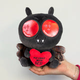 mothman plush being held in hand