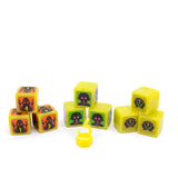 Set of yellow dice with black and orange designs on a white background