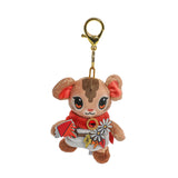 Plush keychain of a cartoon character with a red outfit and flower accessory on a white background