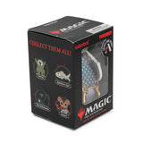 Black packaging box for 'Magic: The Gathering' collectible figurines with branding and promotional text.