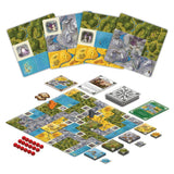 Board game with various cards and pieces on a white background