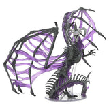 Dragon figurine with purple and black wings on a clear stand against a white background