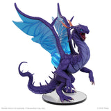 Purple dragon figurine with blue wings on a white background