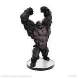 Black and gray monster figurine on a white background