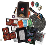 Collection of game components including cards, dice, and a stop sign on a white background