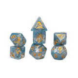 Set of blue dice with gold numbers and symbols on a white background