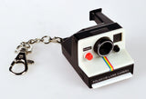 Polaroid Land Camera keychain on a white background