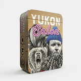 Yukon Salon tin box with a bear and person design on a white background