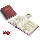 Open book with game-like text and graphics, accompanied by two red dice on a white background.