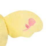 Yellow plush toy with a pink embroidered rose design on a white background
