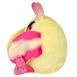 Plush toy resembling a moth with pink wings on a white background