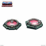 Two toy arena sets with pink center on a white background, featuring 'Masters of the Universe Battleground' logo.