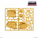 Gold toy figure assembly sheet with 'Masters of the Universe Battleground' logo.