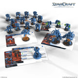 StarCraft tabletop game set with blue units and cards on a white background