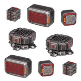 Set of metallic, cube-shaped objects with red and gray design on a white background