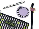 Collection of Beetlejuice-themed stationery items including a pen, mirror, and pouch on a white background.