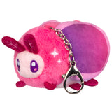 Plush keychain with a gradient pink to purple color scheme on a white background