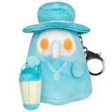 Plush keychain with a blue character wearing a hat and holding a bag on a white background